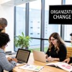 An illustration depicts a team working together around a flowchart, signifying the transformation of an organisation.
