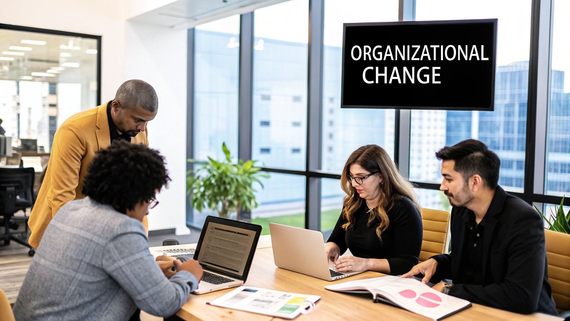 An illustration depicts a team working together around a flowchart, signifying the transformation of an organisation.